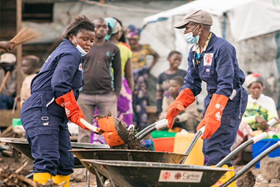 Members Of The Hygiene Committee Assist With The Clean Up Efforts