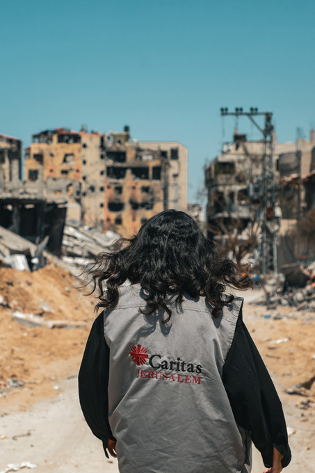 Gaza HET A Caritas Worker Walks Through The Destruction In Gaza Photo Credit Caritas Jerusalem