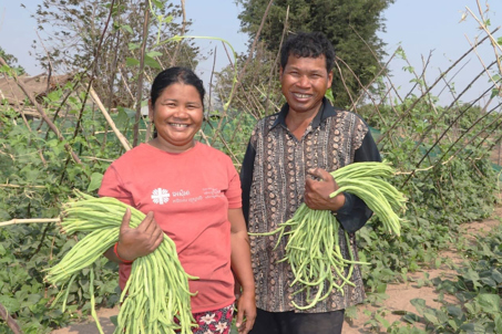 Em And Lat Holding Long Beans On Their Farm In Cambodia. Photo Credit Sam Rinangard