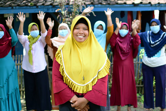 Tarsini and her community members in Indonesia