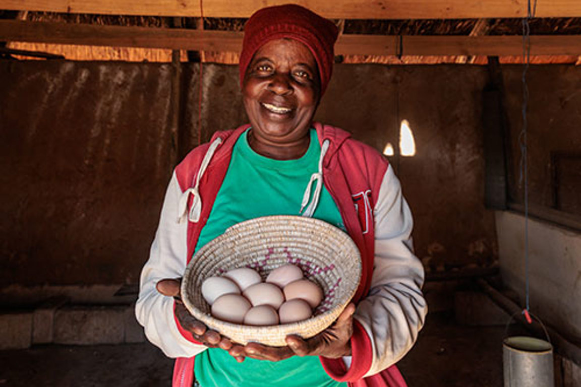 Priscilla Holding Basket Of Eggs