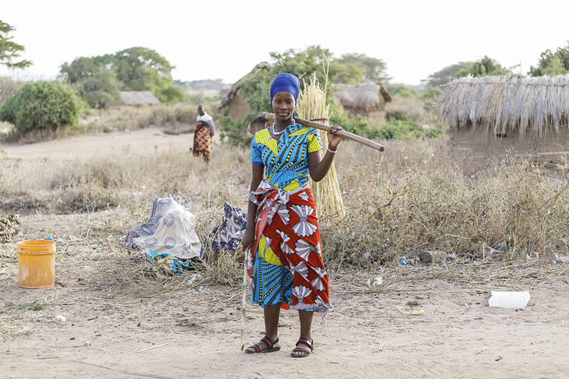 Oliva collecting grain in Tanzania