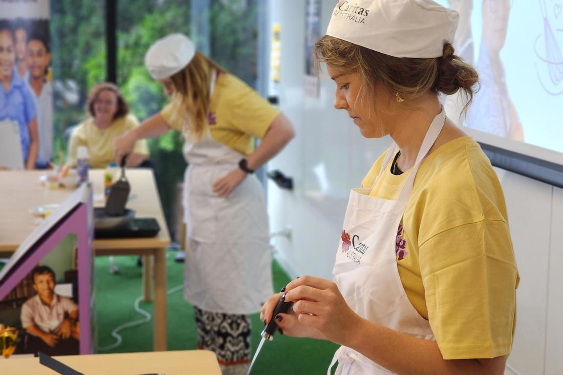 Paige and Tara at making Pancakes at the Project Compassion 2025 Office Launch