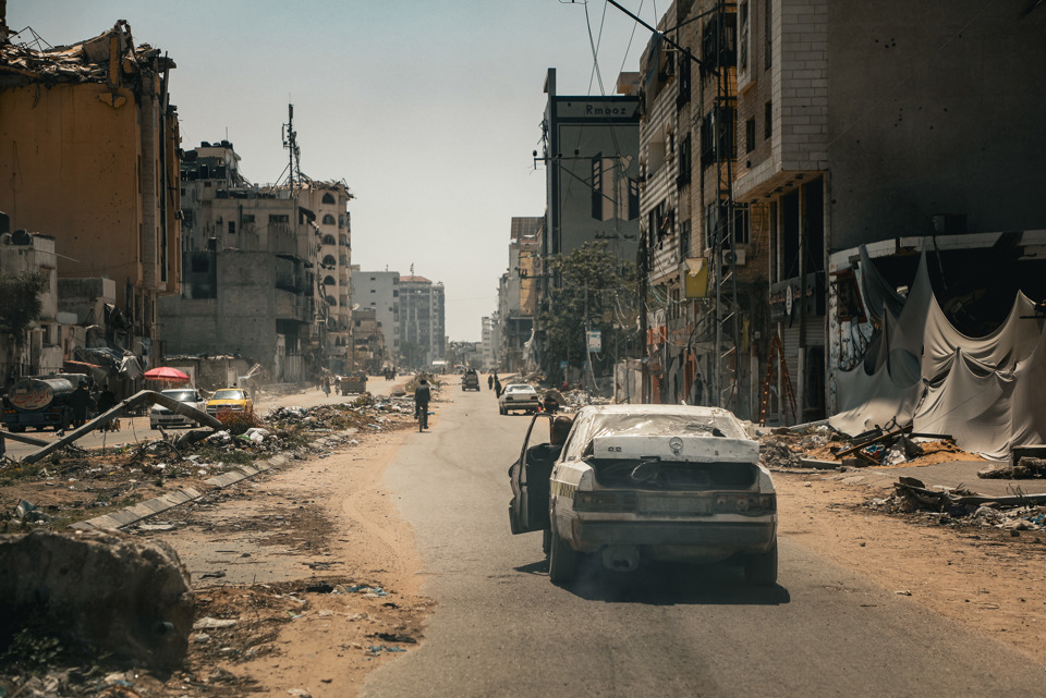 A Burnt Out Car In A Destroyed Neighbourhood In Gaza Photo Credit Caritas Jerusalem