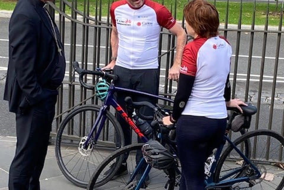 Kirsty and Richard being welcomed to Melbourne by Archbishop Comensoli after their cycle from Sydney to Melbourne to end global poverty.