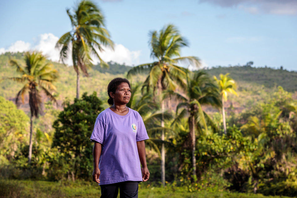 Shirley walking through her Manide community in the Philippines