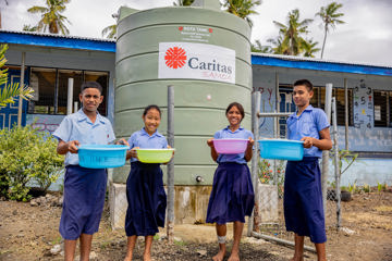 Samoa Students In Front Of Water Tank