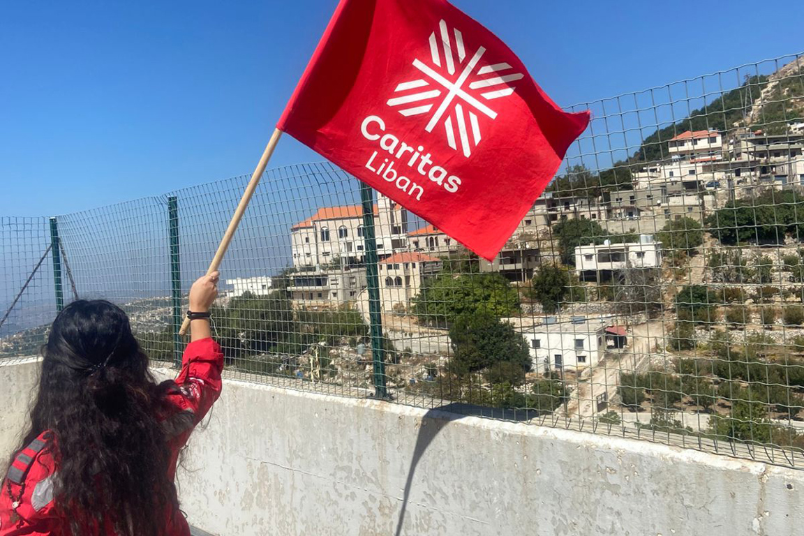 Caritas Lebanon Waving A Flag Photo Credit Caritas Lebanon