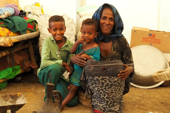 Woman with her family in an IDP camp in northern Ethiopia. Photo Jessica Stone/Caritas Australia.