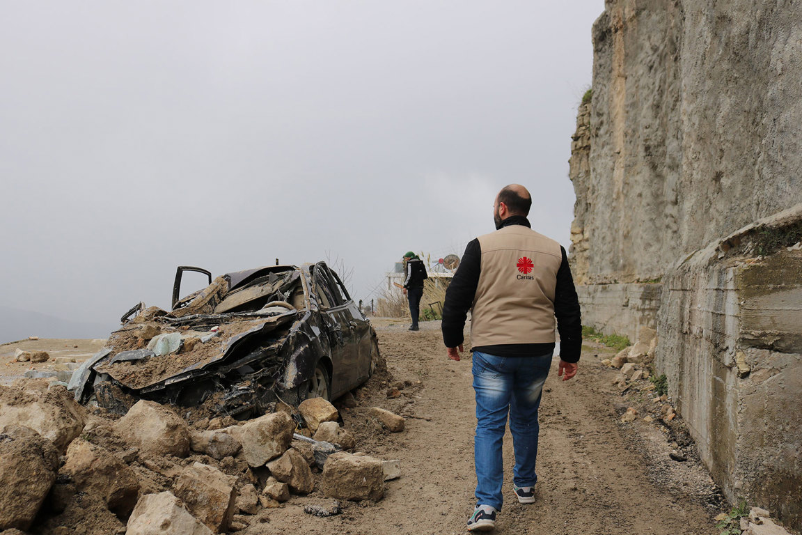 Caritas staff responding to earthquake damage.