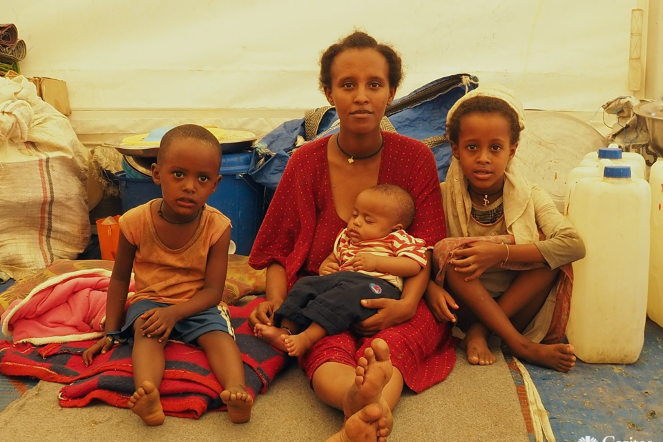 Woman With Her Family In IDP Camp In Northern Ethiopia. Photo Caritas Australia 2