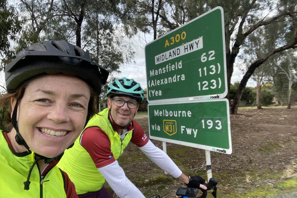 Kirsty and Richard with the sign for Melbourne in sight. Photo: Caritas Australia.