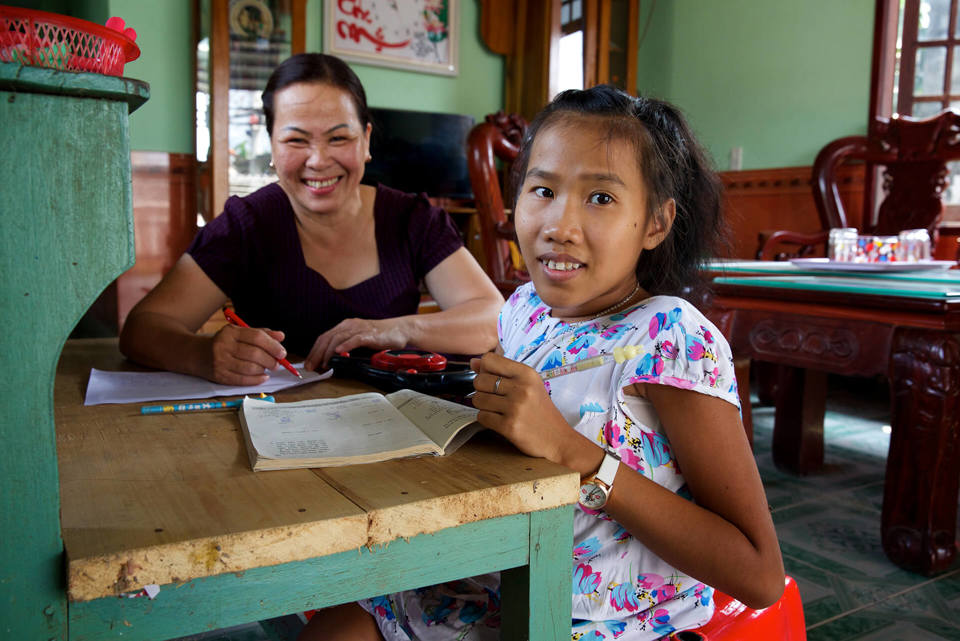 Child learning in Vietnam classroom