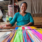 A woman in Nepal weaving