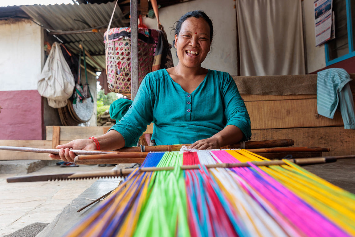 A woman in Nepal weaving