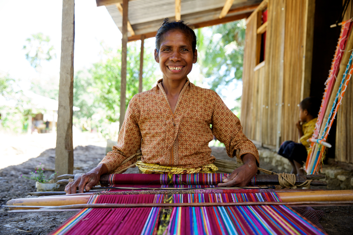 Martina A Beneficiary Of The Timor Leste Protection Program Weaving Traditional Cloth Photo Credit Caritas Australia