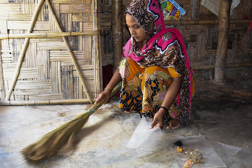 Woman sweeping in Cox's Bazar.