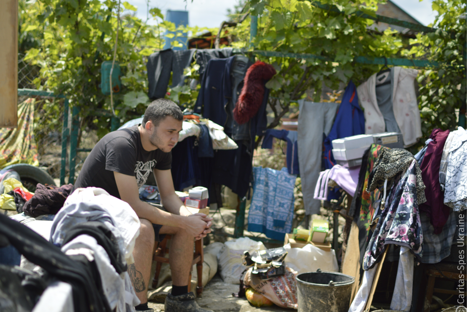 A Caritas Spes Ukraine Beneficiary Drying His Stuff On His Yard Kherson Region After The Dam Explosion Photo Credit Caritas Spes Ukraine